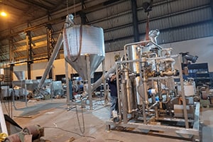 Complete assembly and testing of dry sugar handling system and sugar dissolver